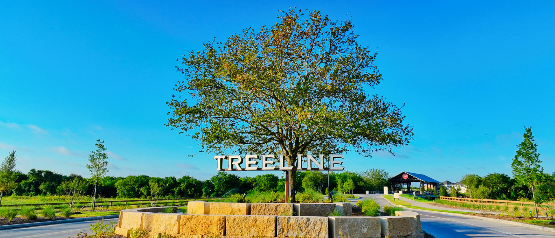 Treeline entrance sign