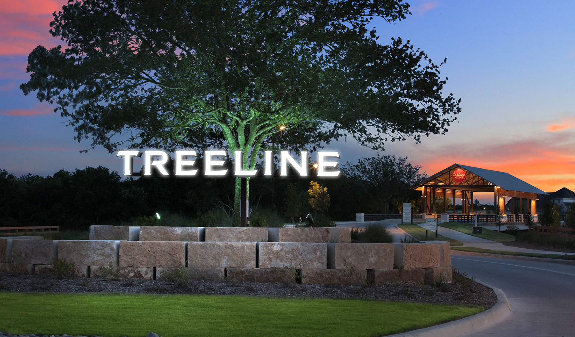The Treeline entrance sign at dusk